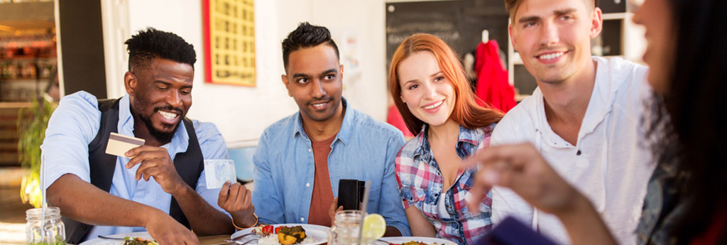 Millennials sitting at a restaurant together